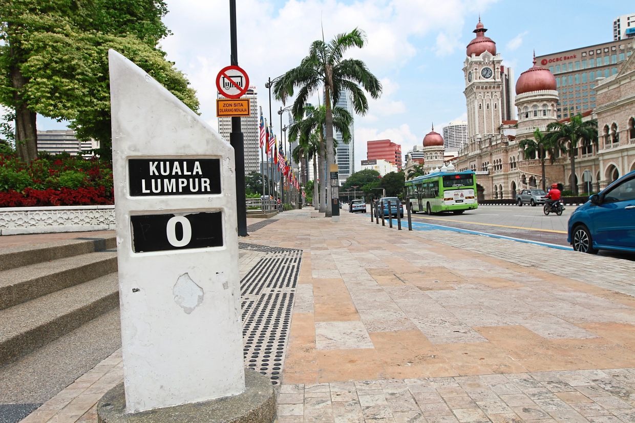 The iconic stone marker with the numerical ‘0’ along Jalan Raja. — Photos: LOW LAY PHON & IZZRAFIQ ALIAS/The Star